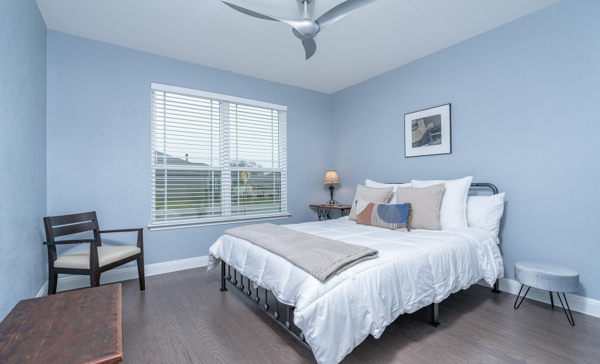 Guest Bedroom with wood flooring, high ceiling and great natural light!