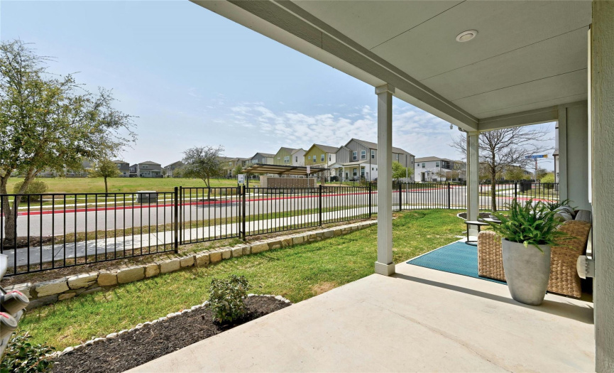 The backyard has a covered patio great for relaxing, and a gate that provides easy access to the neighborhood.
