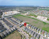 The final aerial view shows the broader neighborhood with the home's location for context.Welcome to Easton Park!The Easton Park amenities facility is walking distance from this home. It's ultra modern and includes an amazing pool, gym, play area, dog park, and other spaces to relax.The pool at the amenity center is well kept and has modern features.The amenities center also has a fireplace great for chilly nights.The center features numerous spaces to relax.The amenity center also features a gated dog park!