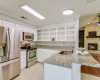 Kitchen with breakfast bar and granite counters