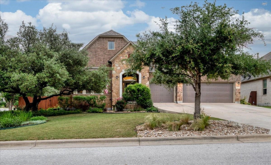The large corner lot has incredible landscaping and a huge 3-car garage.