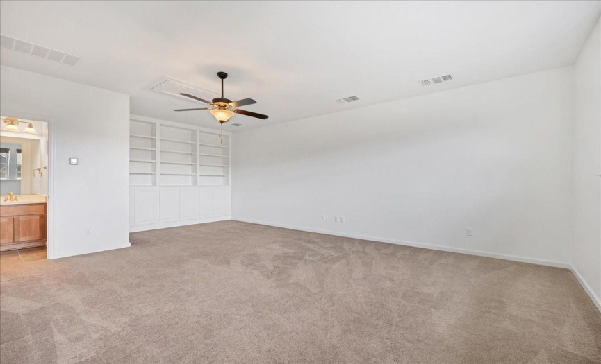 The upstairs bonus room or 4th bedroom is massive and has a closet, custom built-ins, and its own private bathroom.