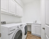 The laundry room also features new quartz countertops and fresh paint.