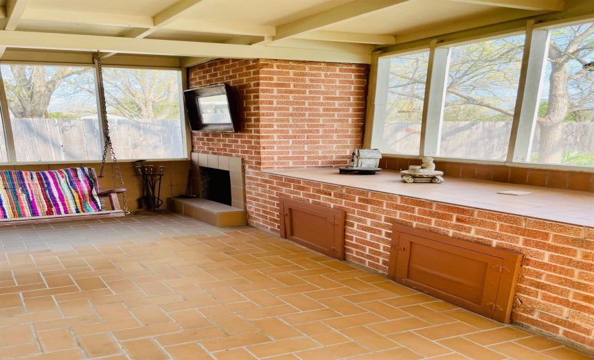 Fireplace in the screened in porch area