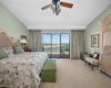 The spacious primary bedroom with lake view