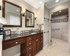 The primary bathroom with large walk-in shower