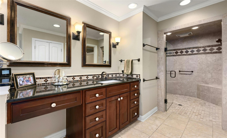 The primary bathroom with large walk-in shower