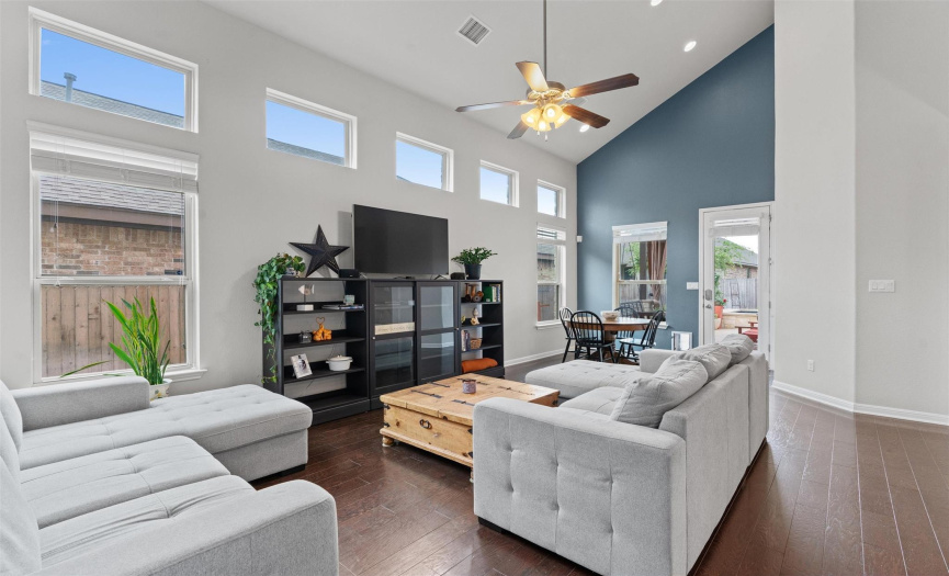 Enjoy the bright living room with vaulted ceilings ..