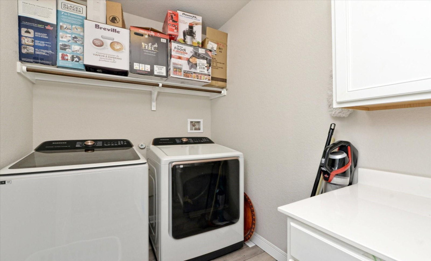 The laundry room has much storage
