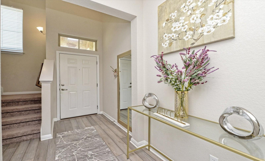 Step into this enviting Foyer with a transom window offering natural light