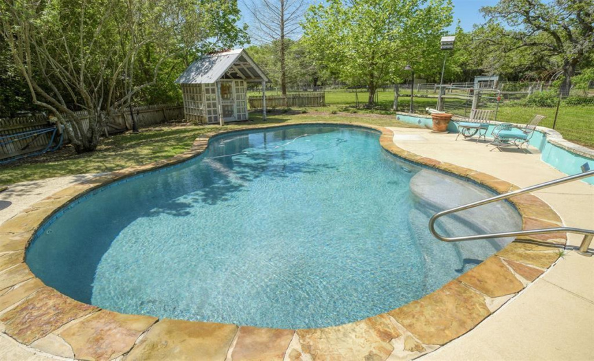 Pool has ample decking around it for sunning and relaxing, is also fully fenced