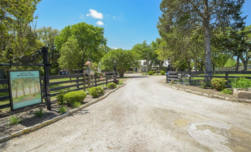 Fenced with auto gated entry into circular drive 