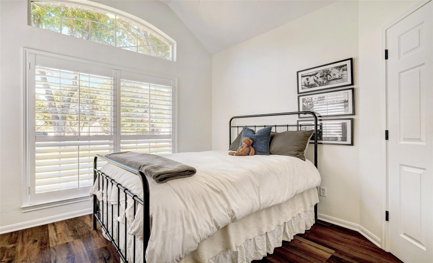 Double doors lead to the first floor space with gorgeous sweeping vault ceiling lines; currently being used as a bedroom but is also optimal for the ultimate light and bright home office. (Wardrobe can convey with the home if you want to utilize this room as a 4th bedroom.)