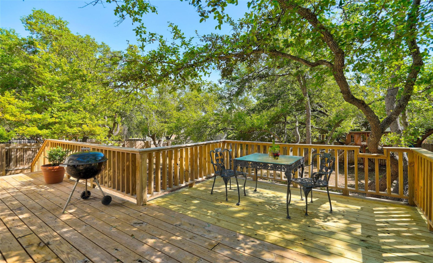 Take in nature in its absdant display of vibrant greens in this gorgeous backyard on your private extended deck.