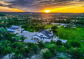 Gorgeous Western Sunset over Texas Hill Country showing view from rear of property