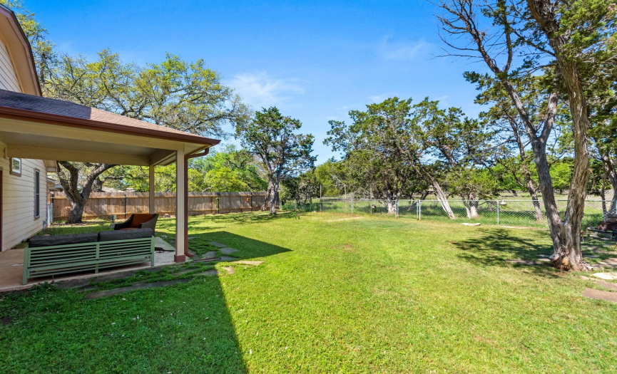 Large, private backyard backs up to a large horse property. 