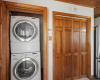 STACKABLE WASHER AND DRYER NEXT TO PANTRY TO CONVEY