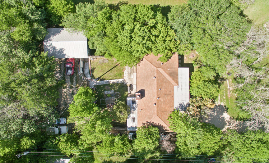Great view of the top of the house & showing the fenced backyard & 2+ car detached garage on the top left.