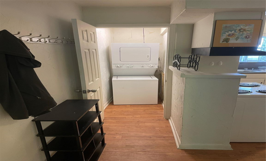 Laundry room in kitchen hallway in B