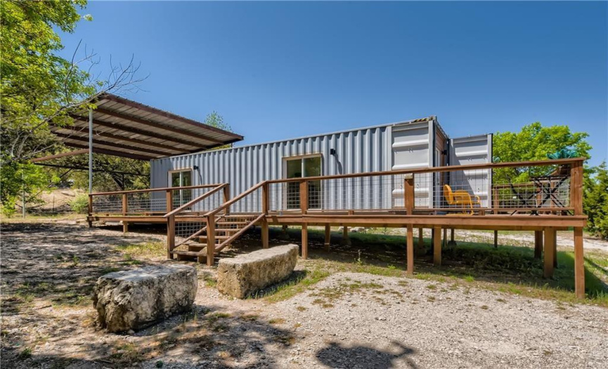 Container home with large deck and covered outdoor space - potential rental or office space! 