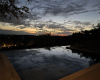 The clouds reflect onto the pool to showcase an amazing Texas sky.