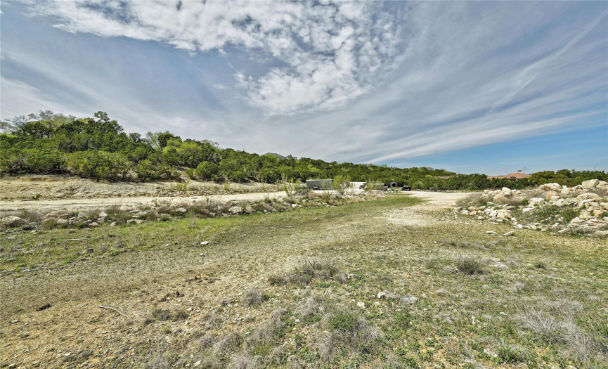 This vantage point shows some of your 3+ acres and the places you can store grown-up toys, raise chickens, or let your imagination run wild! All of this 3+ acres is very usable and accessible.