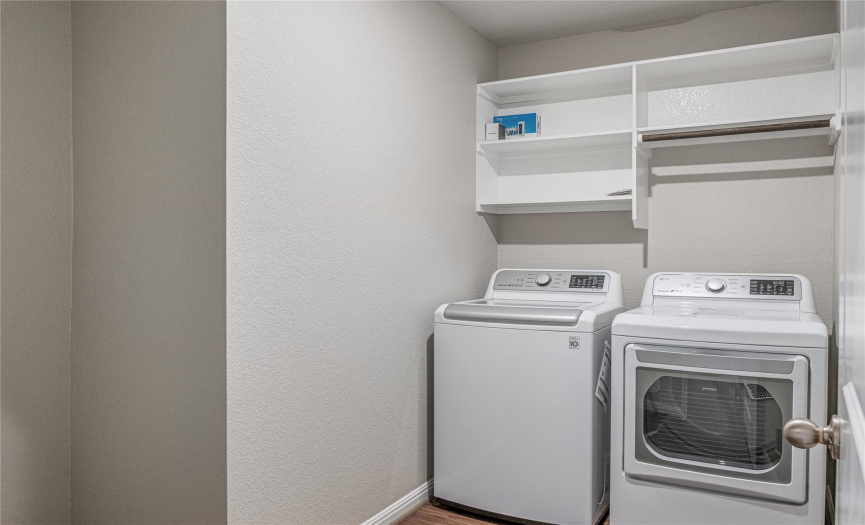 Oversized utility room with space for a full size fridge. 