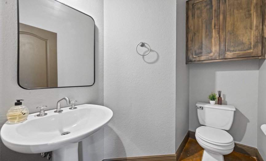 The main floor half bath offers added convenience for guests, completing the functionality of the main living area.