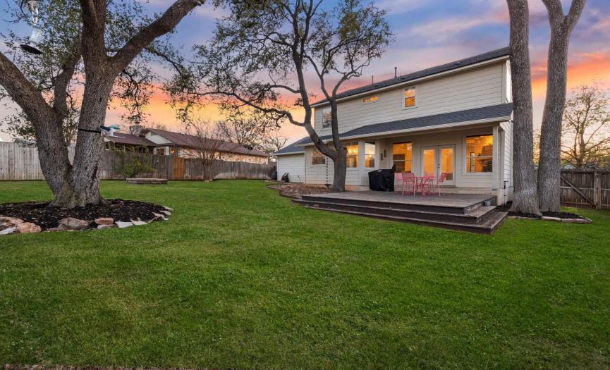 Expansive deck extends the outdoor living space, perfect for enjoying the beautiful Texas weather.