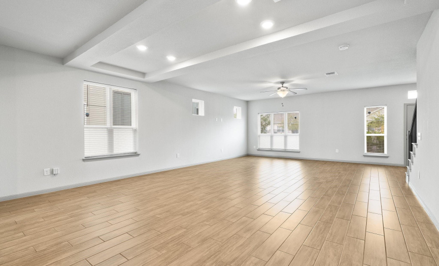 The harmonious paint colors, beautiful flooring and open concept floor plan make for abeautiful, open living space.