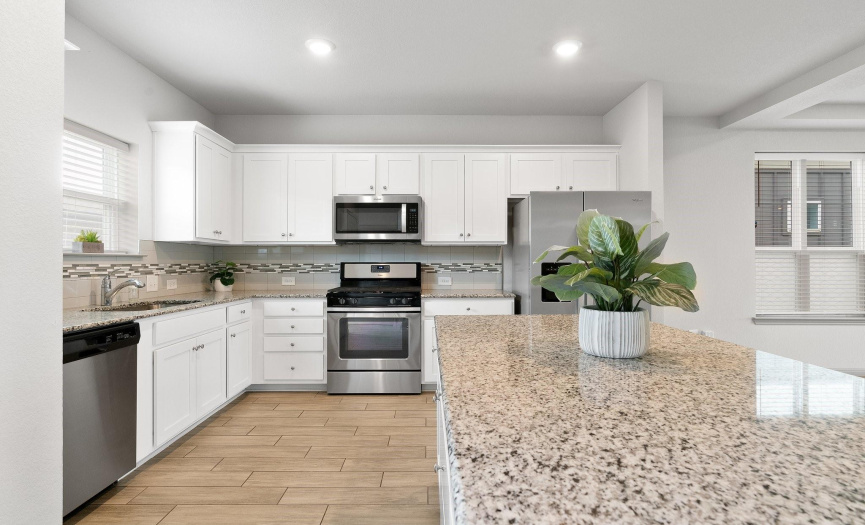 The kitchen offers stainless steelappliances and is open to theliving and dining areas for flow ofconversation and entertaining.