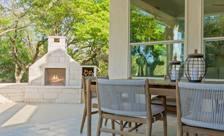 Outdoor fireplace and covered back patio.