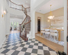 Stunning foyer with formal dining on the right and an office/living space on the left.