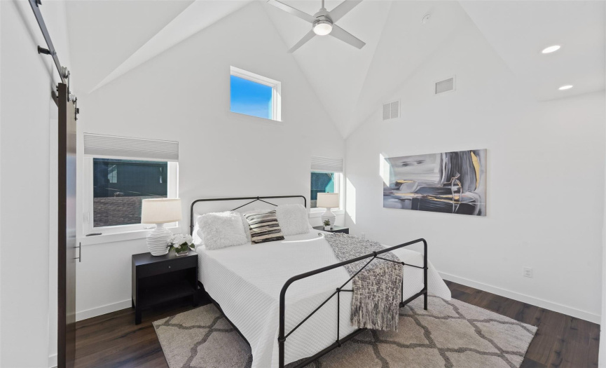 Primary suite on second floor features cathedral ceilings