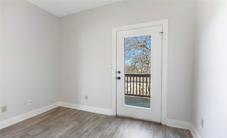 Third bedroom with access to the second private balcony. This space would make for a wonderful home office or nursery!