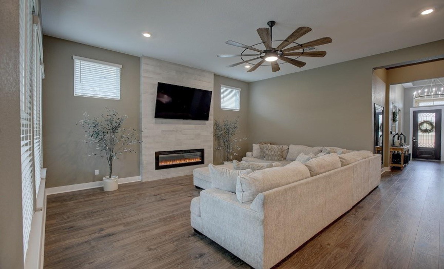 This electronic fireplace really anchors the room. Sexy floor to ceiling tile give the room a fabulous focal point!