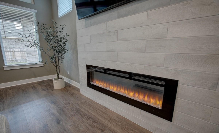 Beautiful electronic fireplace has color choices, and touch controls