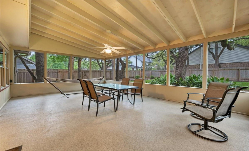 The screened-in back patio is HUGE! Look at all of the space to enjoy dining and entertaining. 