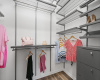 Stay organized in style with the custom walk-in closet, offering ample storage space and keeping essentials neatly tucked away.