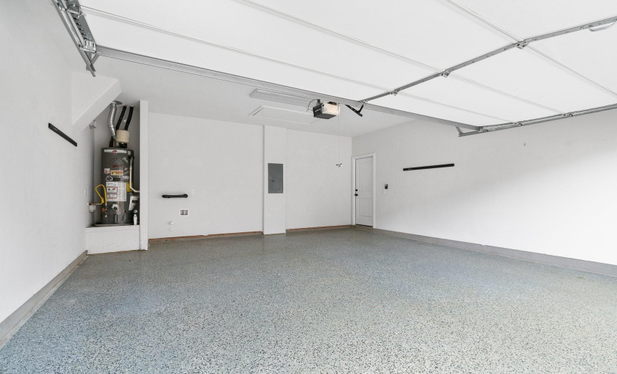Park with ease in the 2-car epoxied garage, providing secure storage and convenience for your vehicles and belongings.
