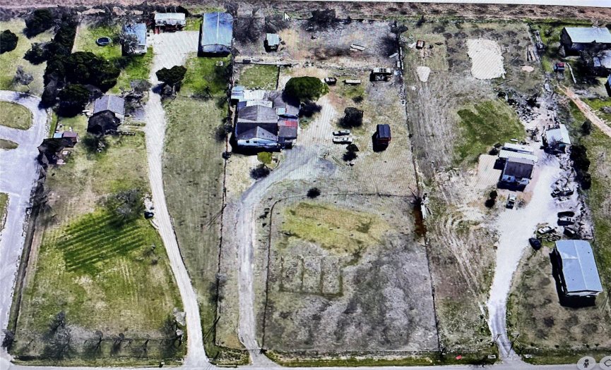 Aerial view from the street looking towards the back of the property