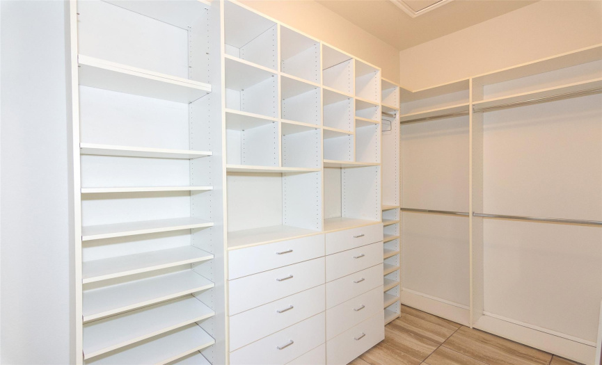 Look at this closet system!  Both ends have double hanging racks, while the middle has drawers and shelving!  There is still a lot of room for storing on the very top, and even dancing!! 