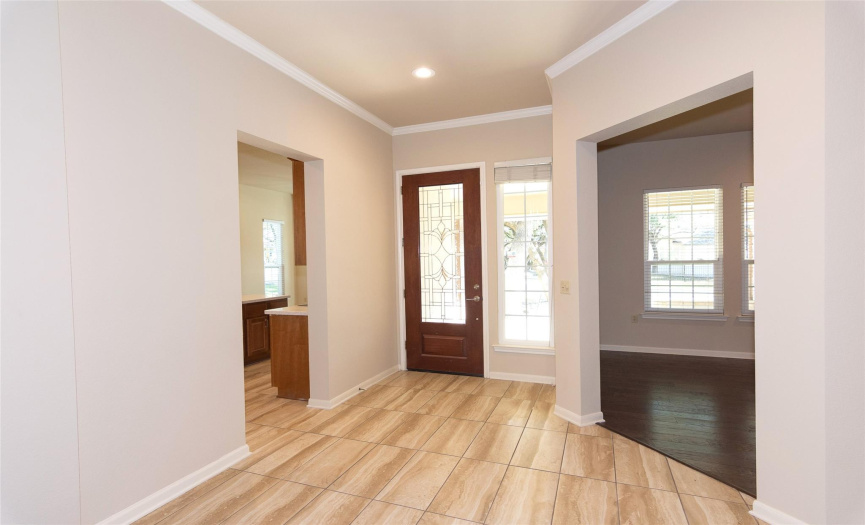 Front entry into this highly sought after Del Webb plan.  Upgraded heavy door adds so much light as you enter the home.