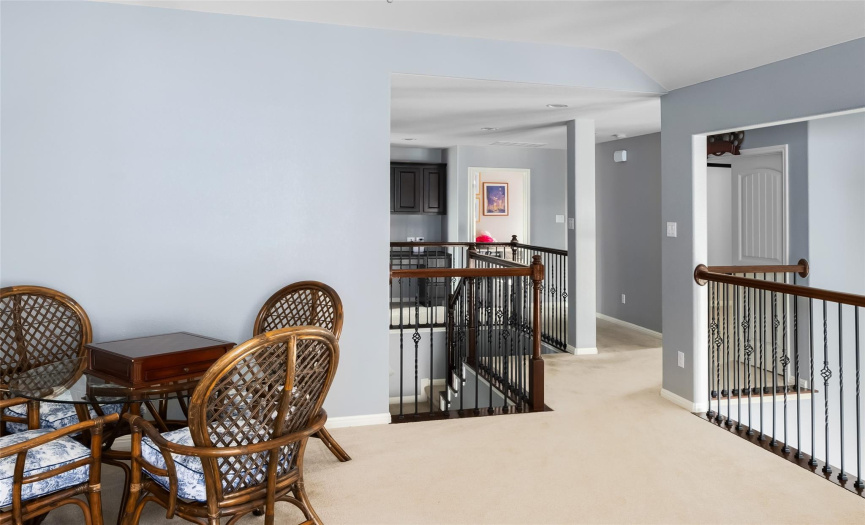 Elegant wood railings and iron balusters line the second floor hallway and game room. There is also a convenient built-in desk/study area in the hallway with the secondary bedrooms. 