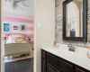 This bedroom also comes with its own private vanity area that connects to the shared jack-n-jill bath. 