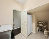 The in home laundry room provides space for a second fridge plus plenty of room for storage. 