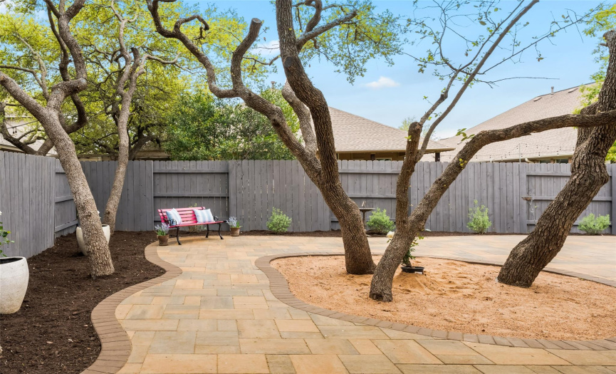 No backyard lawn to mow or water! Enjoy sustainable backyard living with plenty of room to plant your gardens in the mulched areas surrounding the patio. 