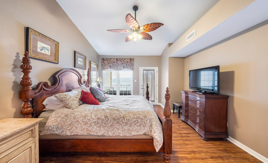 Unwind in the serene ambiance of the bedrooms, each featuring vaulted ceilings, fans, and newly installed LVP flooring. 
