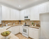 Crisp white cabinets and white appliances create a clean look