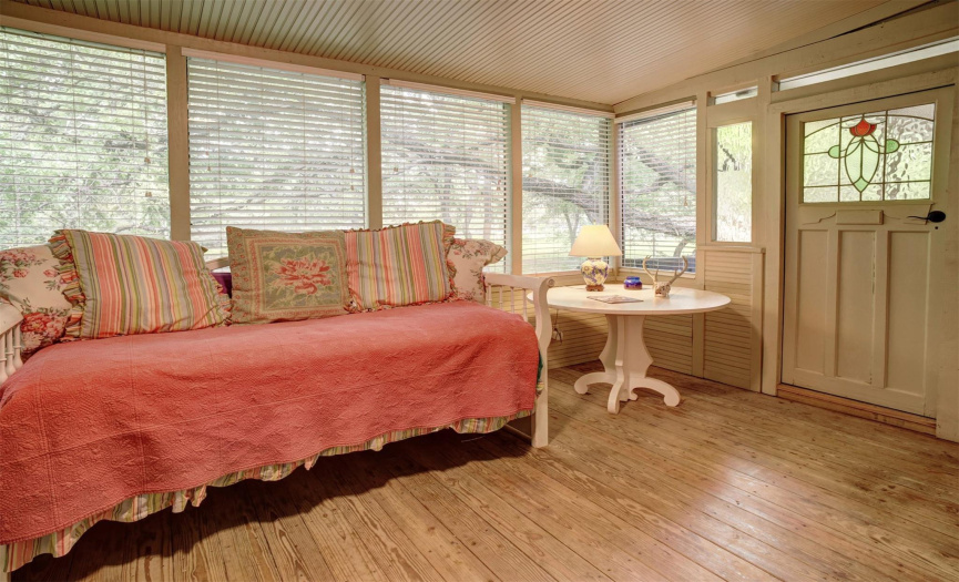 Sunroom off kitchen in historic wing has access to back deck